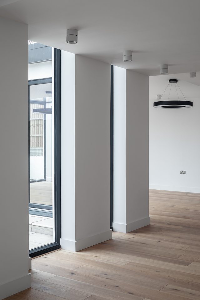 Interior with full-height glazing and oak floor