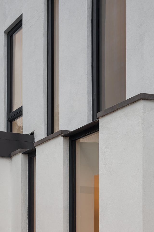 Detail of rendered facade and window reveals